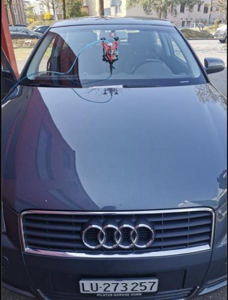Resin injector on the windscreen of an Audi during a stone chip repair